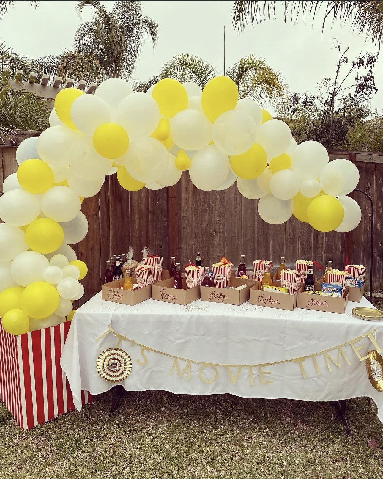 Movie night balloon garland and favor table