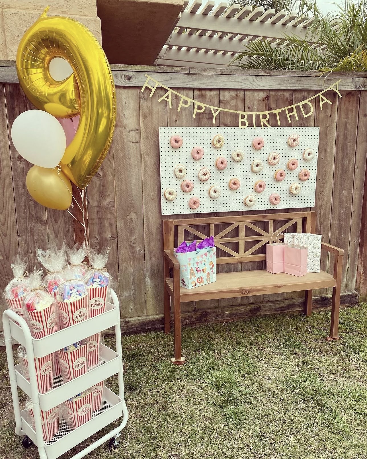Ninth birthday donut wall and favor display