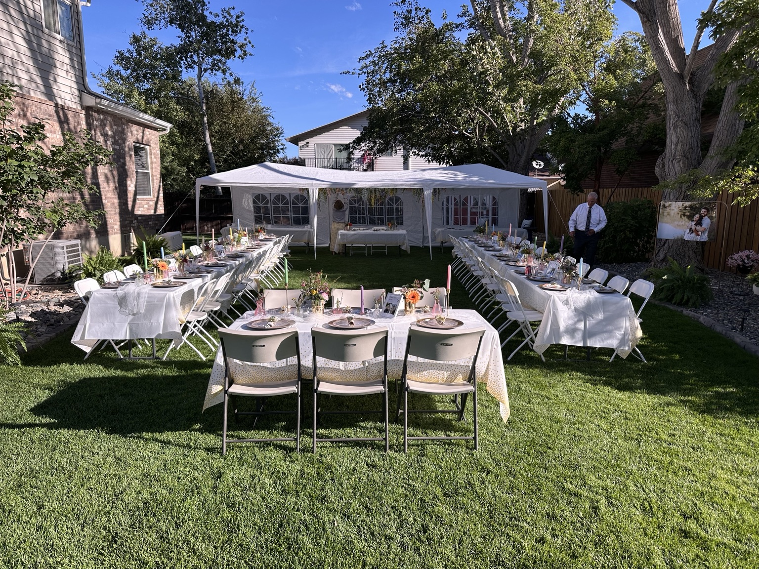 Outdoor celebration with coordinated guest tables and florals